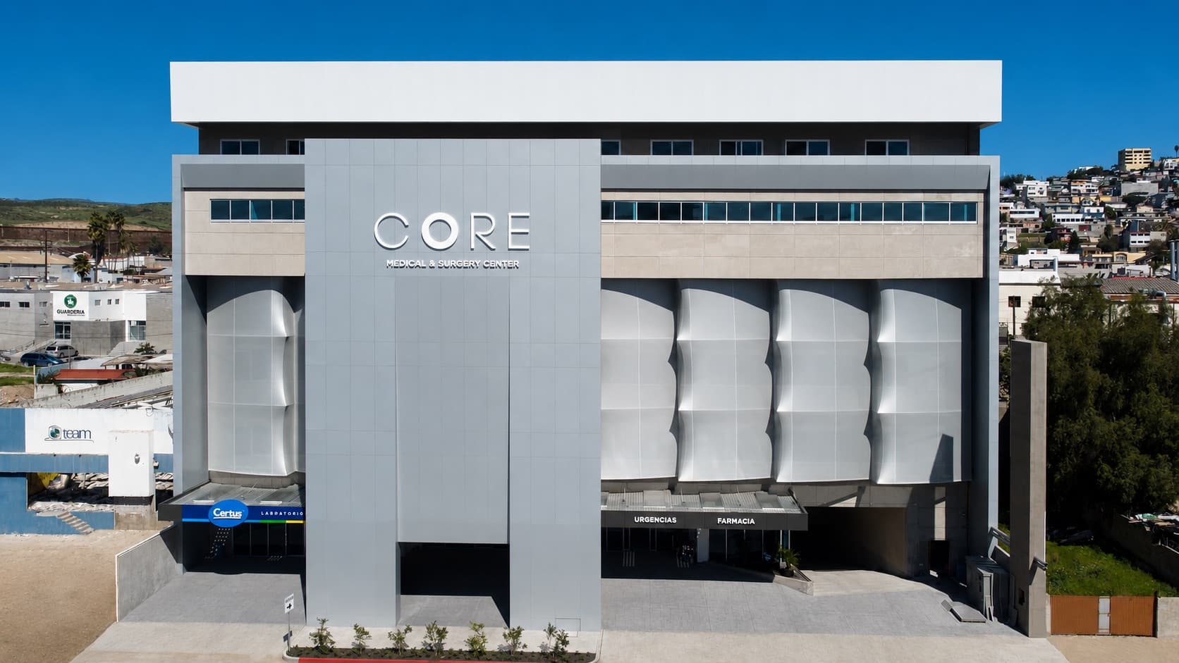 Front exterior of the CORE building, a grey multi-storey facade with CORE lettering above the entrance